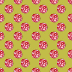 Salami sausage slices background. Close up. Slices of smoked sausage. Food background. Focus on center.