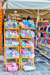 Fototapeta premium Variety of Towels and canvas Hats on Display in Chania, in August 20, 2018