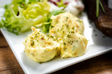 Beef steak with mashed potatoes and rocket salad