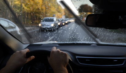 driving in a rainy day by car - obrazy, fototapety, plakaty