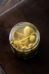 Jar of Capers in Water Pickled and Canned Ready to Eat in Glass Bowl.