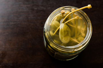Jar of Capers in Water Pickled and Canned Ready to Eat in Glass Bowl.