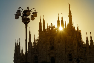 Fototapeta na wymiar Silhouette of Milan Cathedral at sunrise