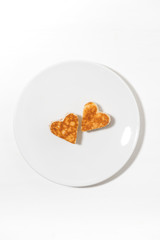 plate of pancakes in the shape of heart, vertical top view