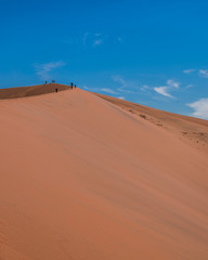 Fototapeta na wymiar walking the dunes in namib desert deadvlei namib desert namibia