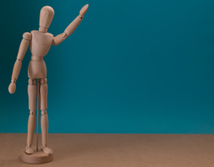 Wooden mannequin. Saying hello. Greetings. Thank you. Concept.