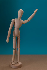 Wooden mannequin. Saying hello. Greetings. Thank you. Concept.