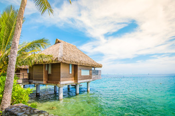 Overwater villa at the beach of Tahiti. - obrazy, fototapety, plakaty