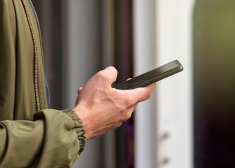 person using smartphone in one hand