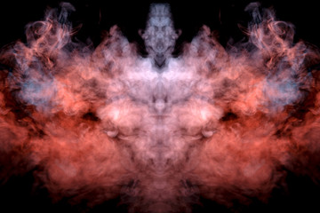 A mystical pattern of colored smoke of red and white in the shape of a ghost's face with fangs creating a feeling of fear on a black isolated background from a horror movie.