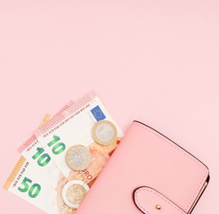 Wallet with Euro Currency on a Pink Background. Business Concept