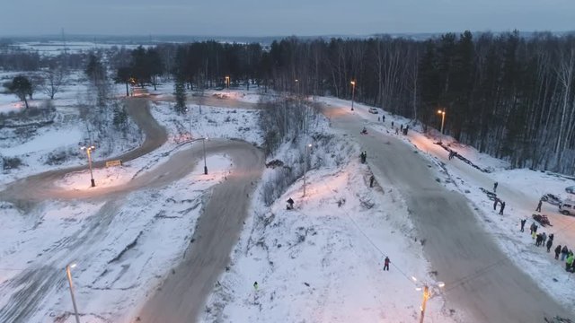 Russia, Championship on snowmobiles January 27, 2018: Winter racing on snowmobiles. Aerial view: Action from snowmobile races.