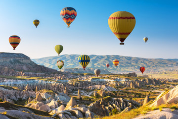 Hot air balloons flying in sunset sky Cappadocia, Turkey