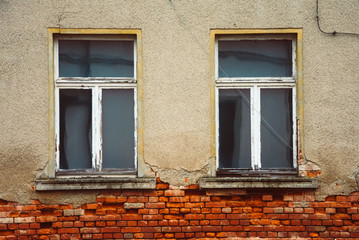 Fototapeta na wymiar Brick wall with old windows