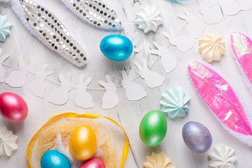 Easter holiday background. Flat lay of natural colored eggs, top view, copy space, horizontal composition. Background