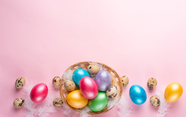 Easter eggs with rabbit ears on a pink background. Lay lay with space for design.horizontal composition. Greeting card concept