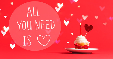All You Need Is Love message with cupcake and heart ornament