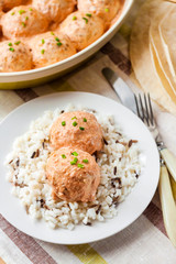Chicken meatballs in creamy tomato sauce with rice