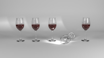 Five wine glasses with one fallen and empty