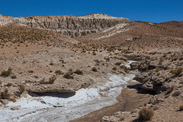 Eroded rock formations along Quebrada Chuba, a river valley high on the Altiplano of northern Chile in Lauca National Park.