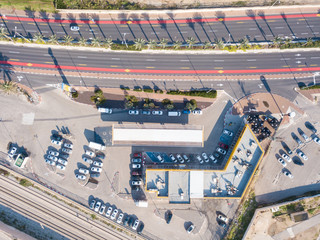 Gas station and Highway road - Top down aerial image.
