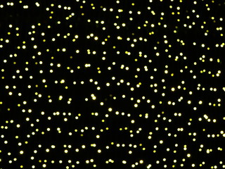 Abstract background with stars, glitter golden lights on black background