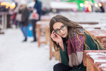 focused woman with glasses in winter