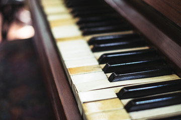 Old and broken piano. Selective focus. Copy space.
