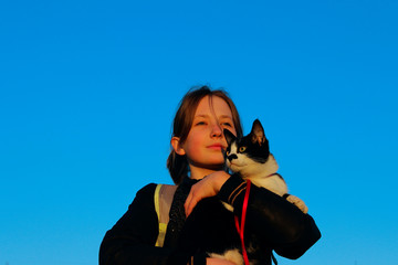 Young Teenage Girl Holding A Tuxedo Cat. Owner And Pet. Children, Animals, Pets, Travel Concept.
