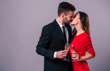 Together forever with love. Elegant stylish happy couple with champagne in hands