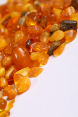 Baltic amber stones on white background