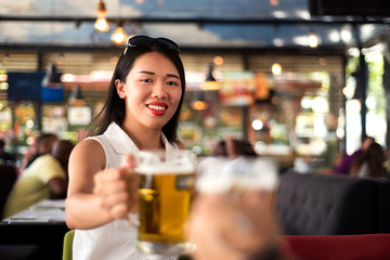 Girl having a beer in the bar
