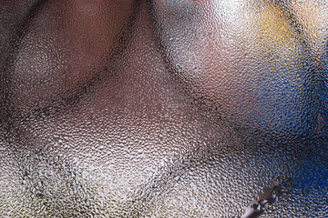 Water drops on glass window close up with blurred background. Drops in macro. Condensate on window closeup. Wet air.