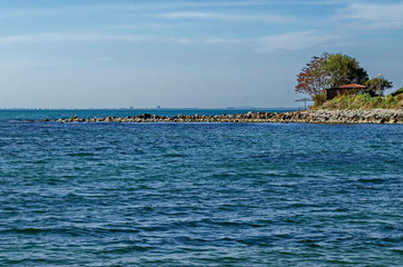 Seascape of pier for fishing in the Black Sea with larus, small house and tree at coast, ancient city  Nessebar, Bulgaria, Europe  