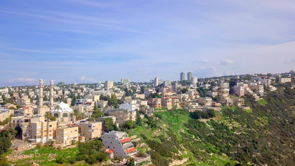 Fototapeta na wymiar Aerial image of the city of Haifa, Israel above and over the slopes of Mount Carmel.
