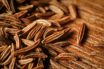 Dry cumin seeds or caraway. Extreme macro photography.