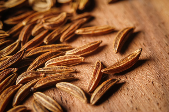 Dry cumin seeds or caraway. Extreme macro photography.