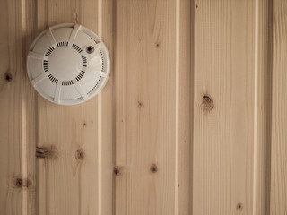 fire alarm of fire detector on a ceiling. the texture of wood, Board, background