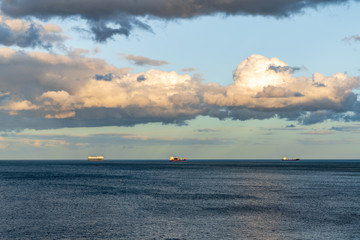 Fototapeta premium Ships waiting on the North Sea Coast in Whitley Bay, Tyne And Wear, England, UK