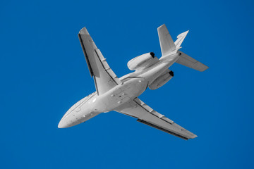 White modern private business jet in the flight