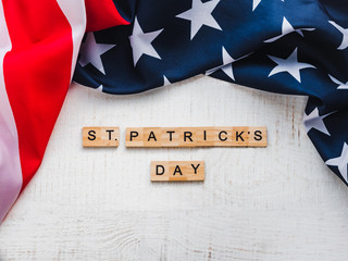 Fototapeta na wymiar St.Patrick 's Day. Beautiful card. White isolated background, close-up, top view, wooden surface. Congratulations for loved ones, relatives, friends and colleagues