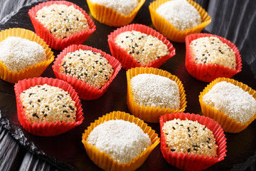 Japanese dessert Daifuku peanut sesame Mochi and mung bean close-up. horizontal