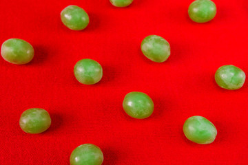 Vine grape berries on red.