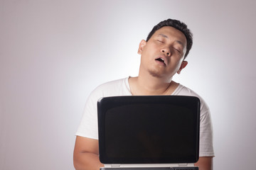 Tired Sleepy Man Overworked with Laptop
