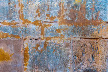 Rusted stone wall. Aged mediterranean stone wall. Medieval architecture.