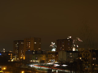 Fototapeta na wymiar City on New Year's Eve in Poland, visible fireworks