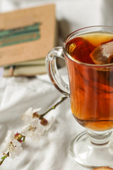tea, hot drink (against the background of flowers). copy space