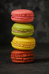 macaron or macaroon cake, colorful cookies (dark background). copy space