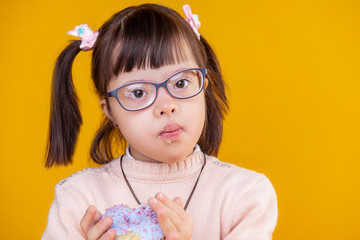Curious pretty child with chromosome abnormality having crumbles