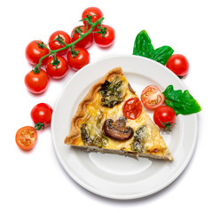 Slice of traditonal homemade spinach chicken quiche tart or pie on plate